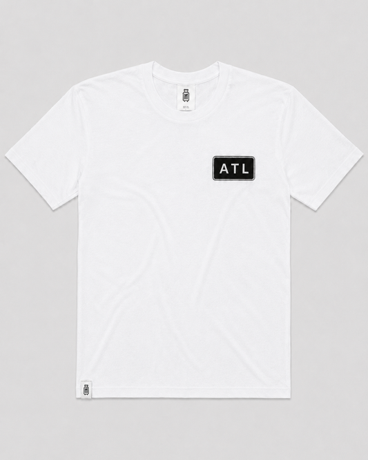 White t-shirt with 'ATL' logo on a gray background