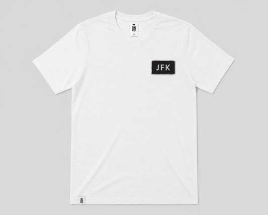 White t-shirt with 'JFK' logo on a gray background