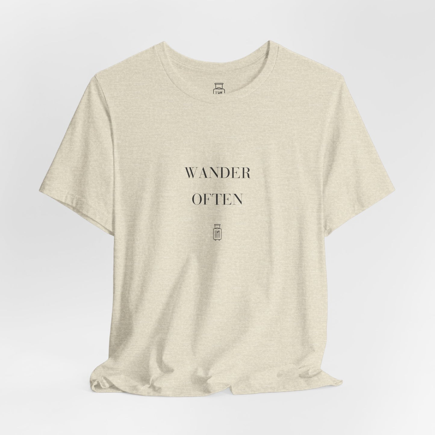 Wander Often Heather Prism Natural tee draped on a light studio background