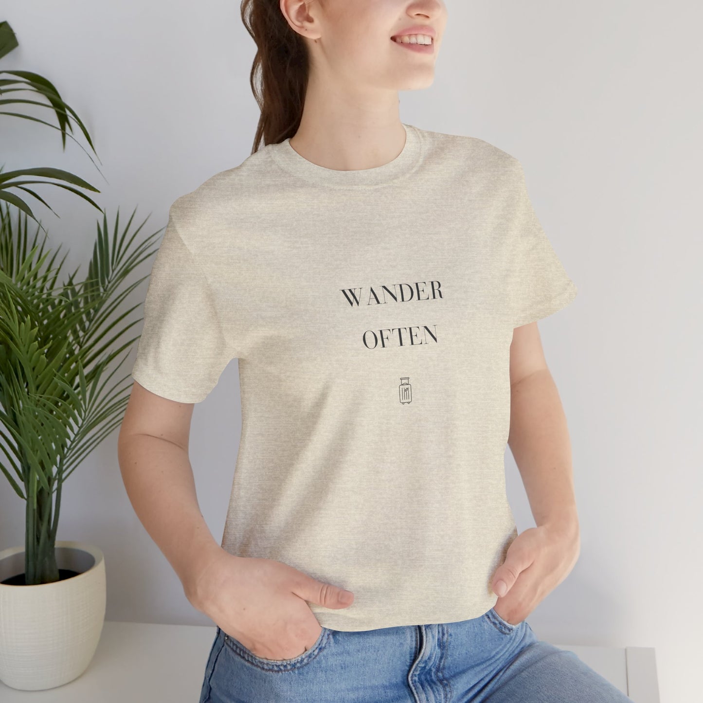 Woman wearing the Wander Often Bella+Canvas 3001 tee in Heather Prism Natural