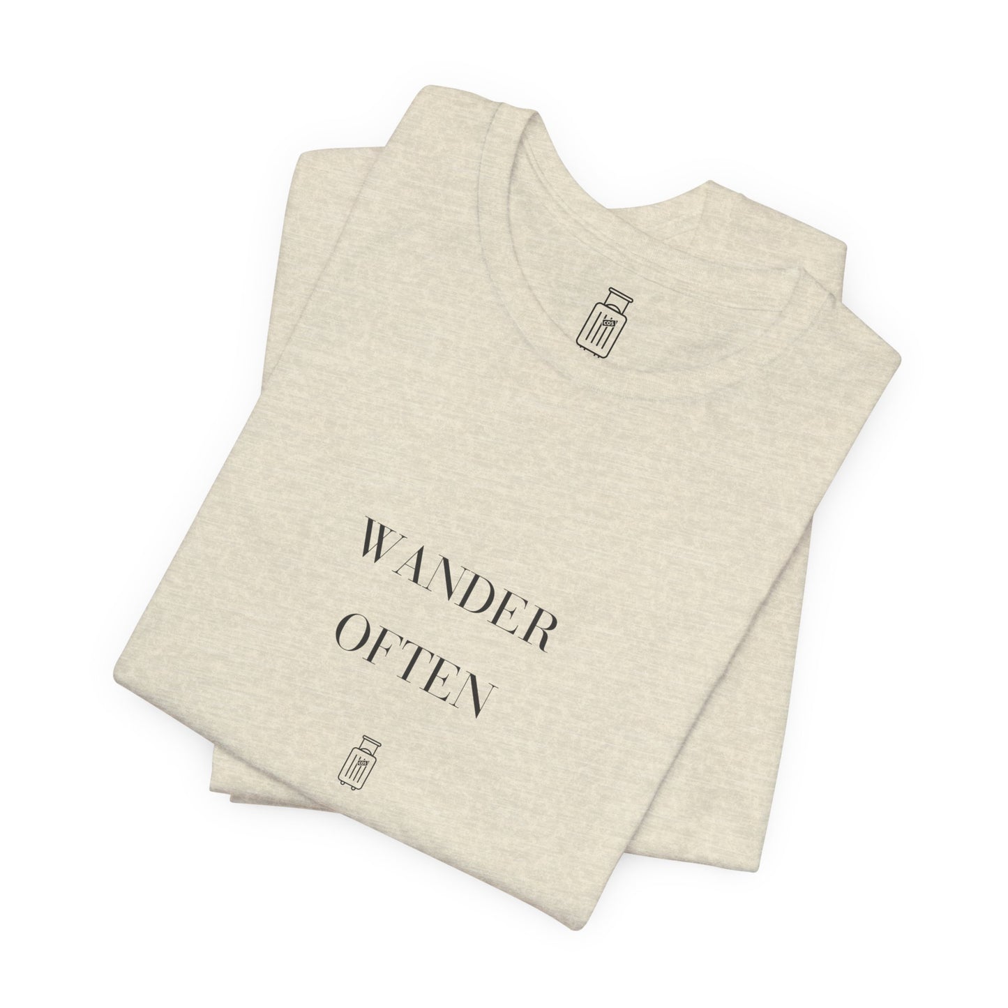 Folded Wander Often travel tee showing the front artwork and Journey Mark
