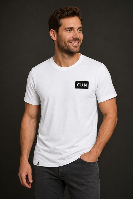 Man wearing a white t-shirt with CUN on a black background