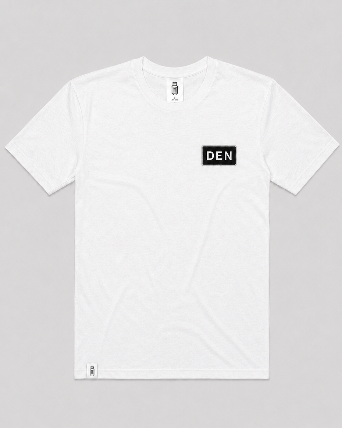 White t-shirt with 'DEN' logo on a gray background