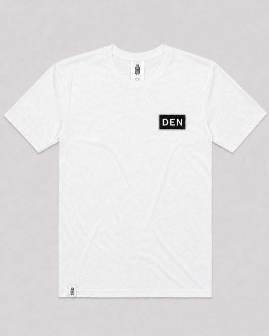 White t-shirt with 'DEN' logo on a gray background