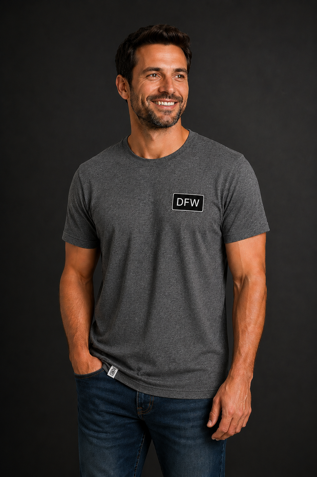 Man wearing a gray t-shirt with a 'DFW' logo on a black background