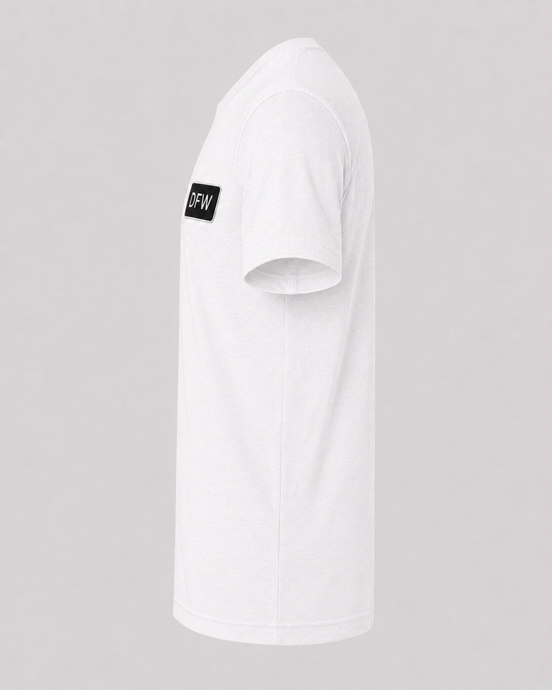 White t-shirt with a black logo on the sleeve against a gray background