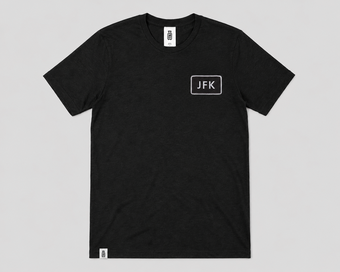 Black t-shirt with 'JFK' logo on a gray background