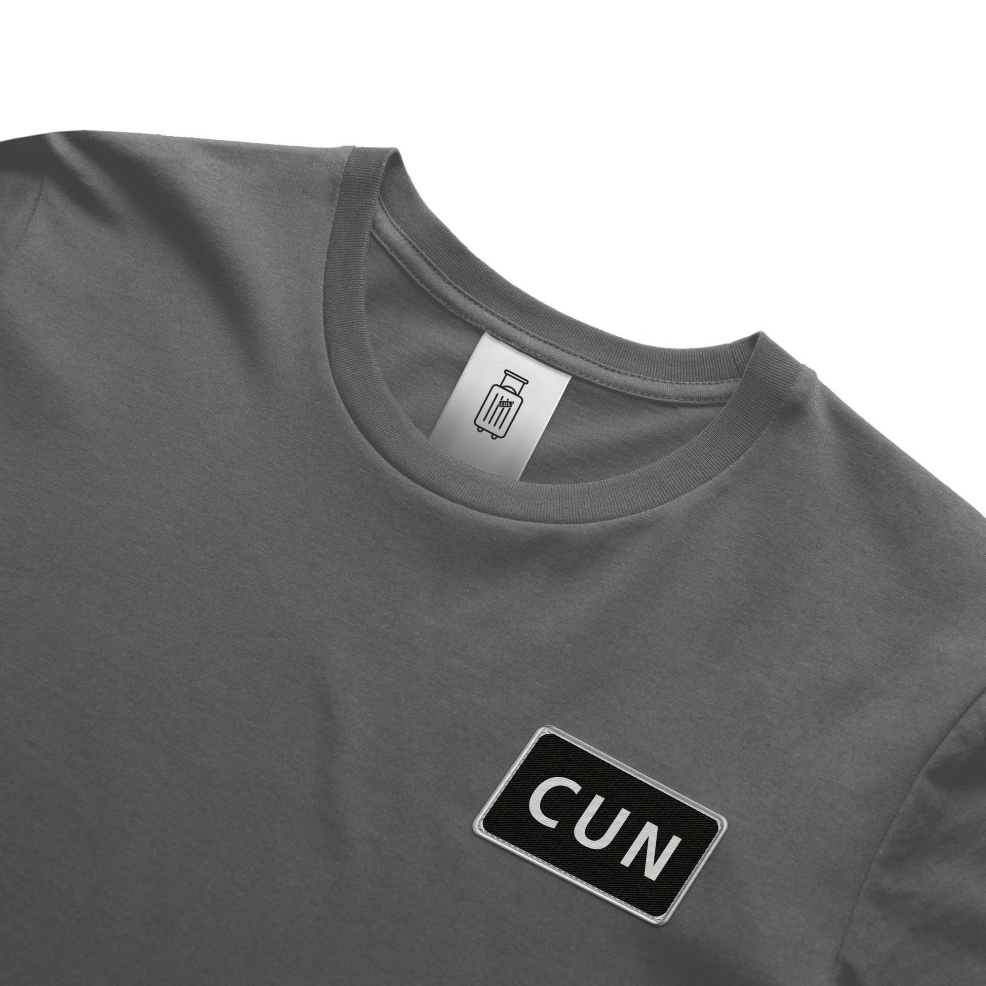 Close up of CUN airport code design on ultra premium t-shirt gray