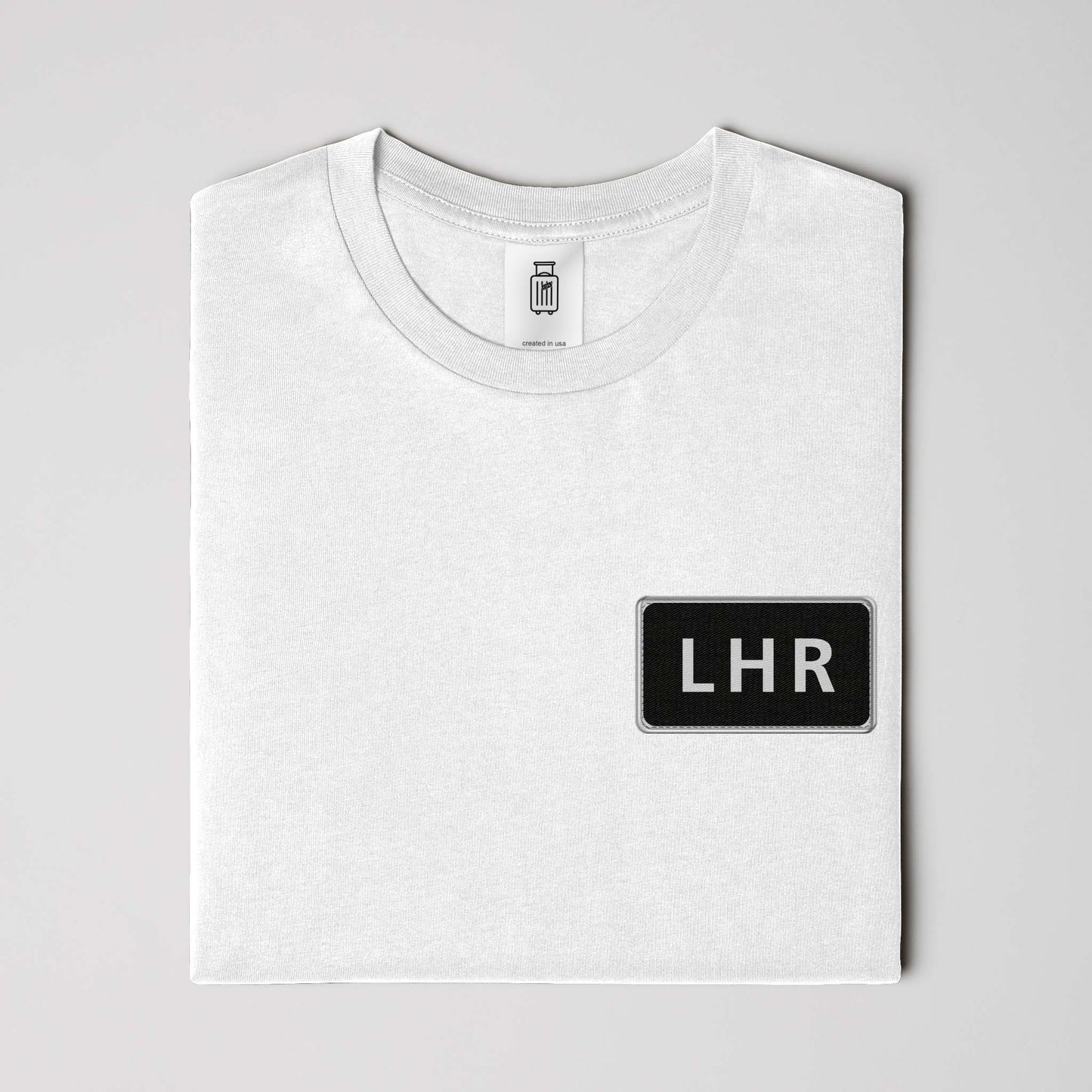 Close-up of LHR airport code design on ultra premium t-shirt white