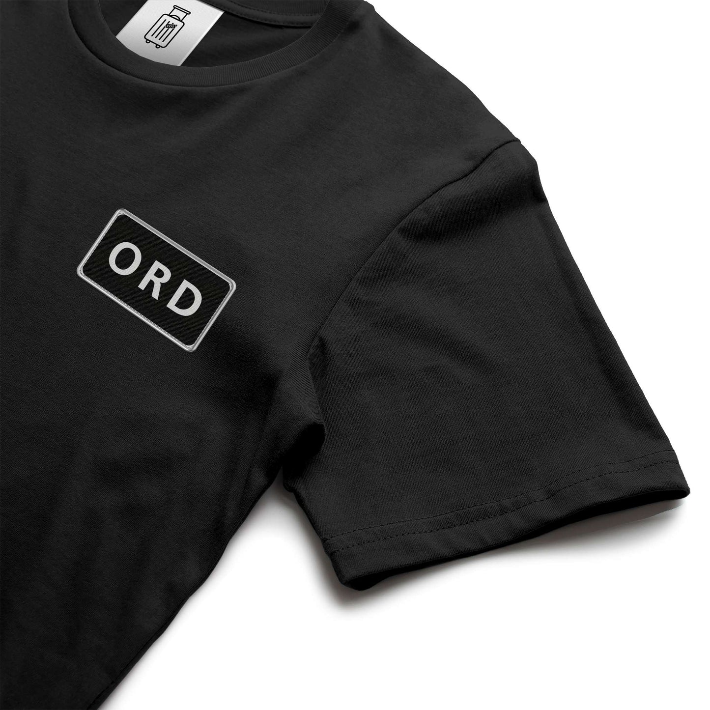 Close-up of ORD airport code design on ultra premium t-shirt black
