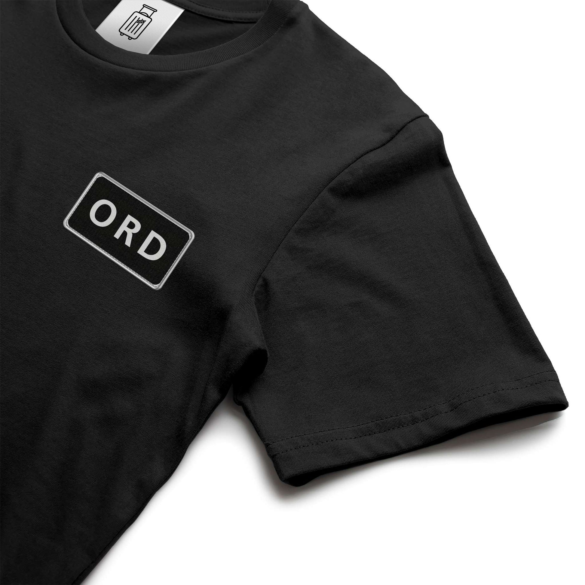 Close-up of ORD airport code design on ultra premium t-shirt black