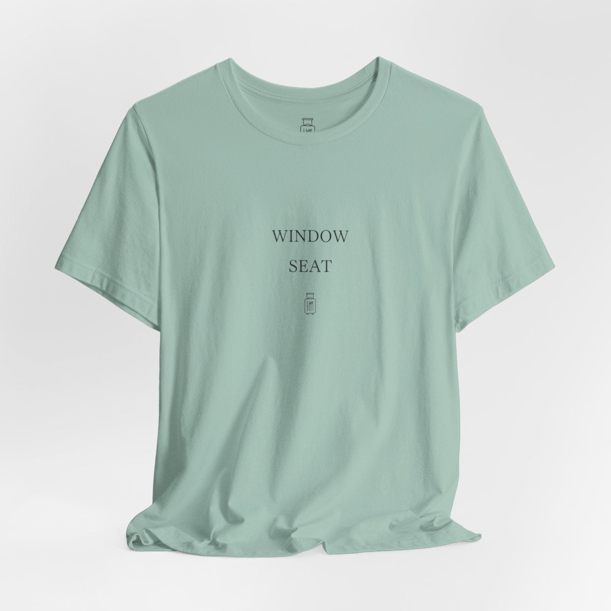 Window Seat travel tee in Dusty Blue, hanging view